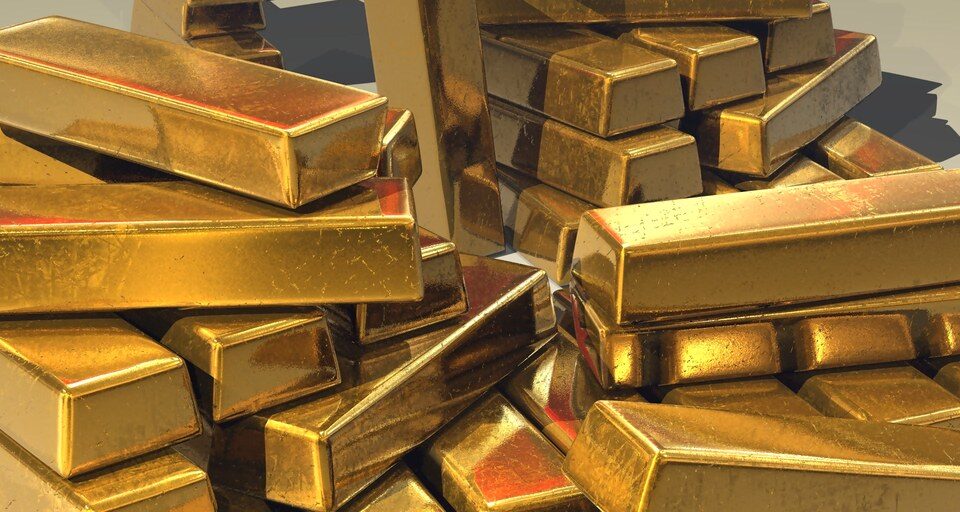Stacked gold bars representing the density comparison between tungsten, lead, and gold