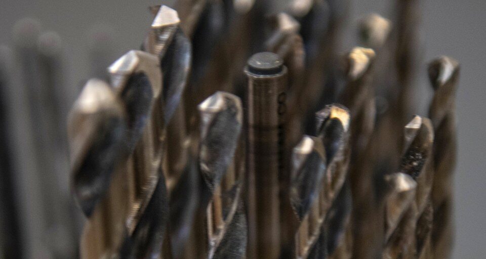 Twist drill bits organized by size, representing the tooling used to machine tungsten heavy alloy